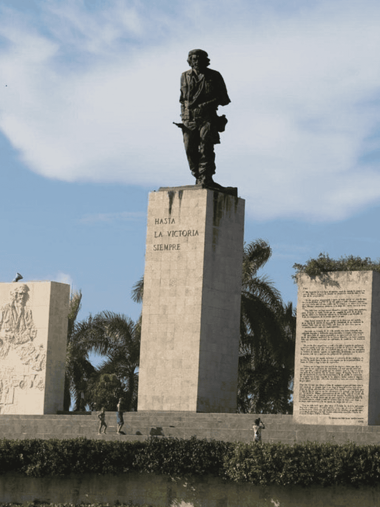 Victory monument with statue and inscriptions, symbolizing historical triumph and patriotism.