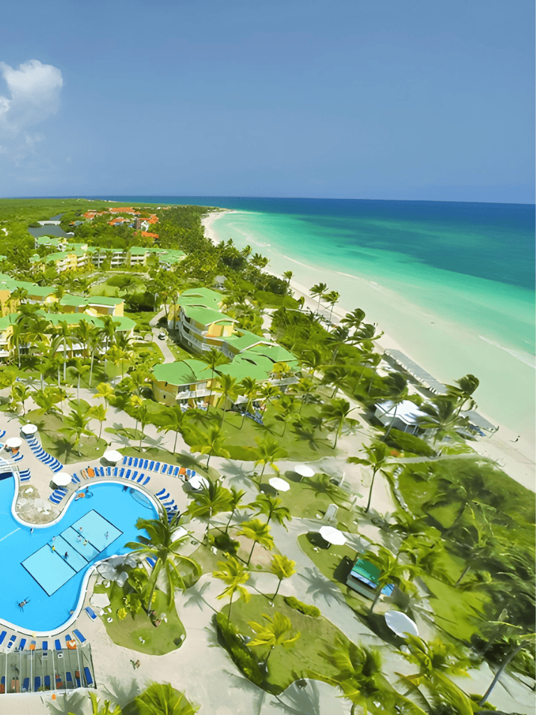 Luxurious beach resort with pools, palm trees, and ocean views for a perfect vacation.