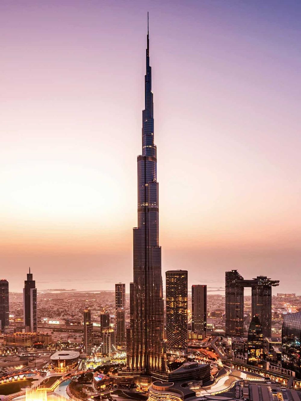 Iconic Dubai Burj Khalifa at sunset, tallest building in the world, modern city skyline, travel destination, architectural marvel.