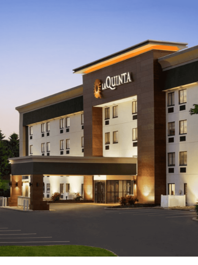Elegant La Quinta hotel exterior at dusk in QuestForDirections imagery.
