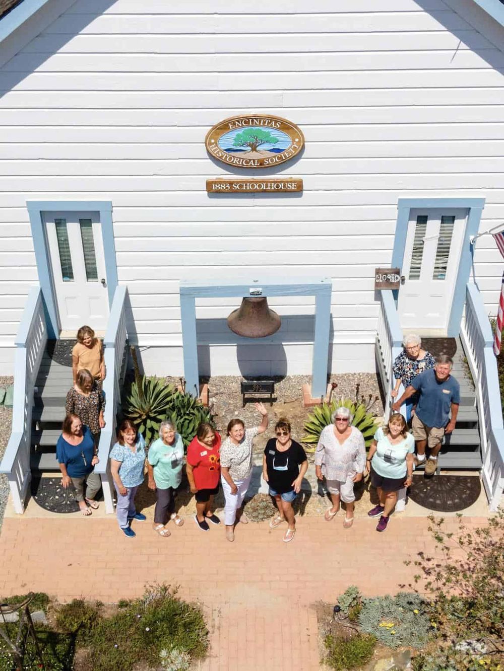 Historical society group photo outside Encinitas Schoolhouse, built in 1883, part of QuestForDirections history tour.