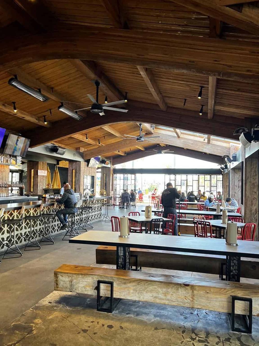 Cozy modern restaurant with wooden ceiling, bar, and spacious seating area, perfect for dining at QuestForDirections.