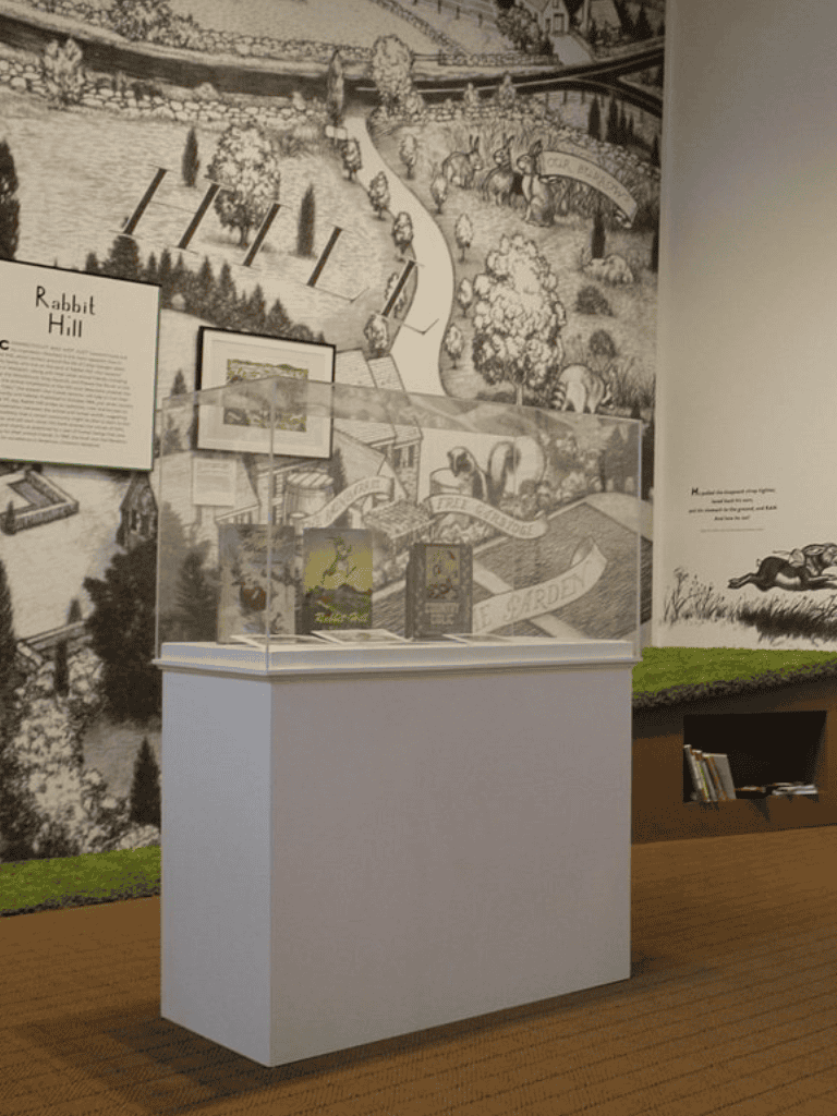 Colorful garden-themed illustration of Rabbit Hill with detailed pathways and wildlife displays.