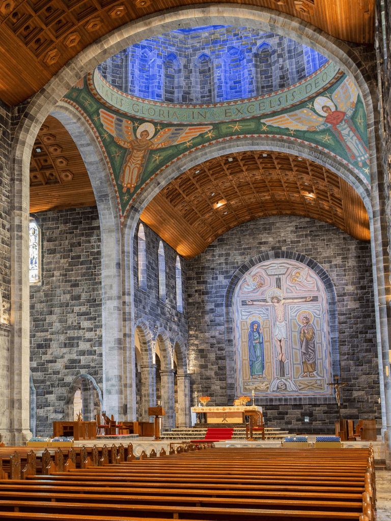 - Church interior with stone walls, wooden ceiling, and colorful religious murals.