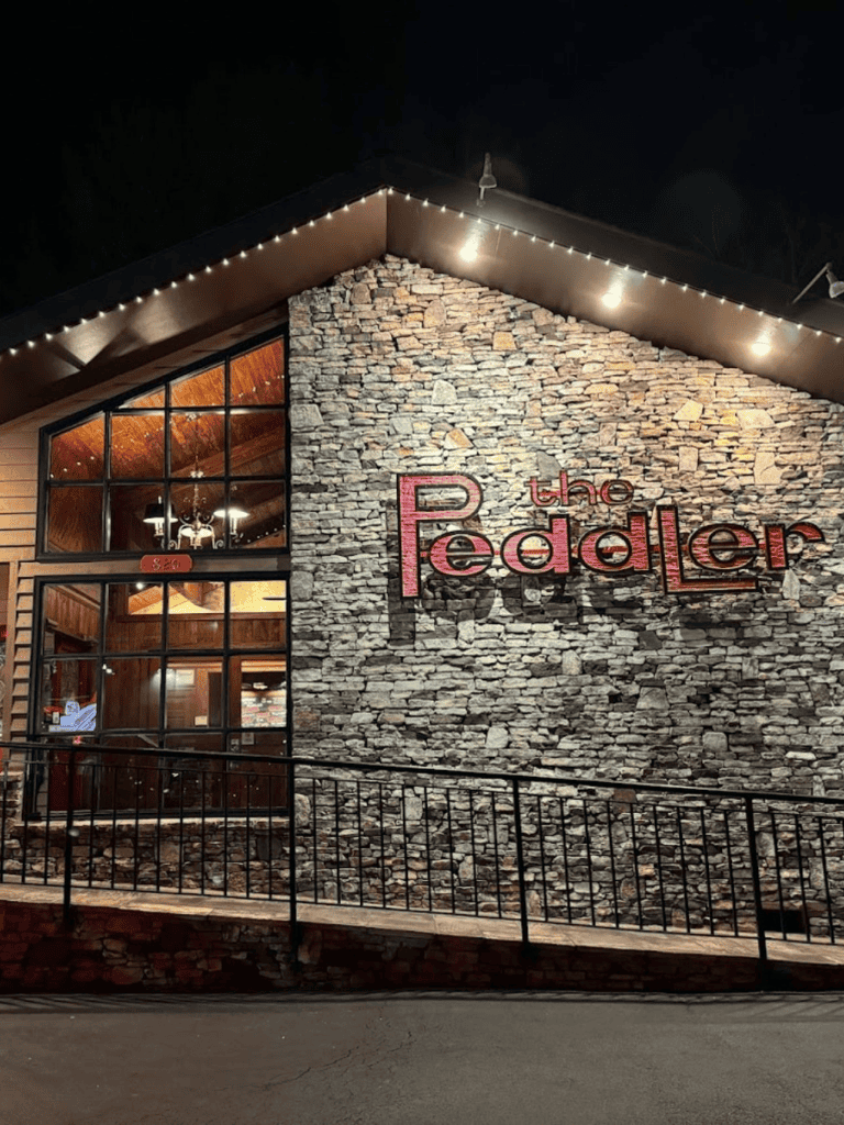 Cozy lodge with stone exterior and warm lighting, perfect for mountain retreat or hotel stay.