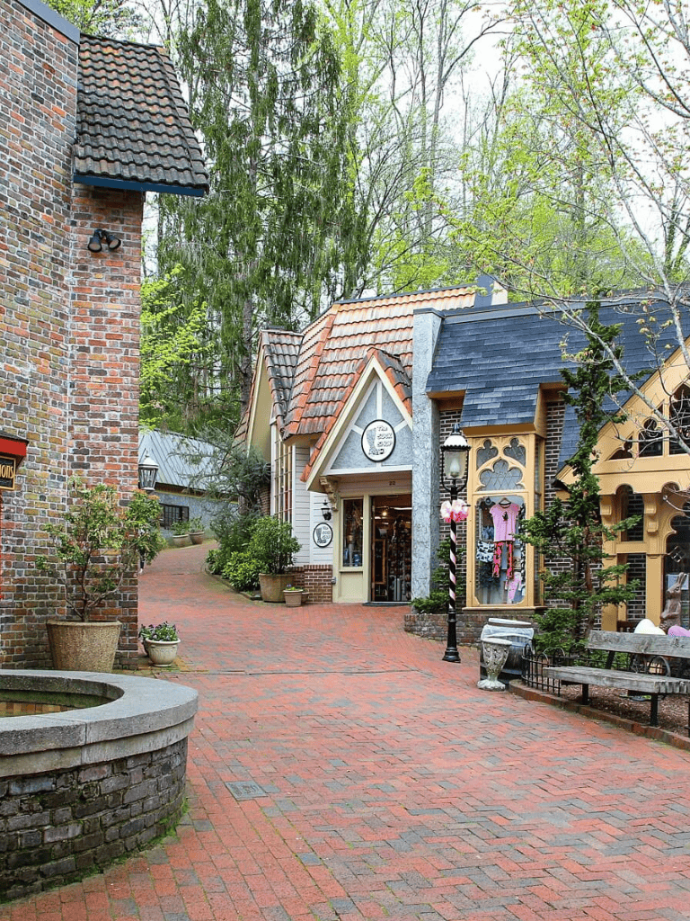 Charming quaint shopping village with boutique stores and brick-paved walkways, perfect for exploring and finding unique gifts.