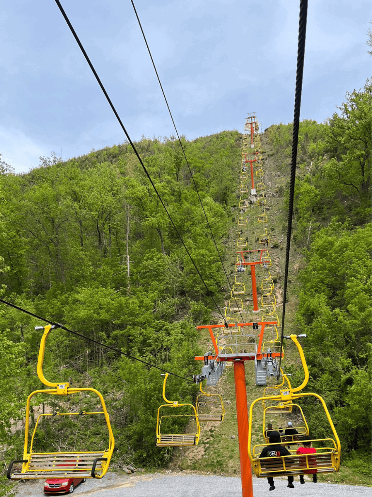 Enjoy scenic mountain views on Quest for Directions' chairlift adventure. Perfect for outdoor enthusiasts and nature lovers.