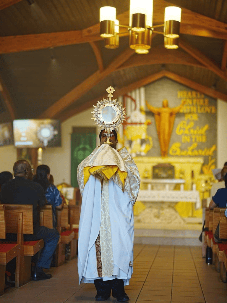 Holy Eucharist procession during mass in church.