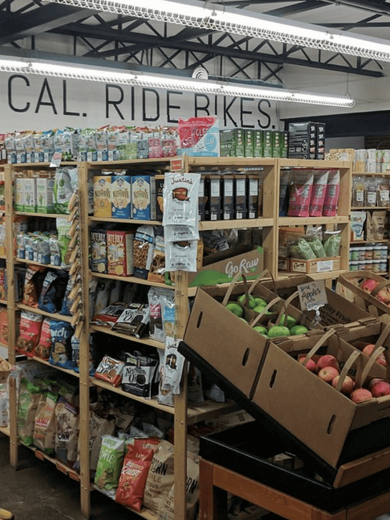 Organic produce and snacks on display at QuestForDirections store for healthy lifestyle shopping.