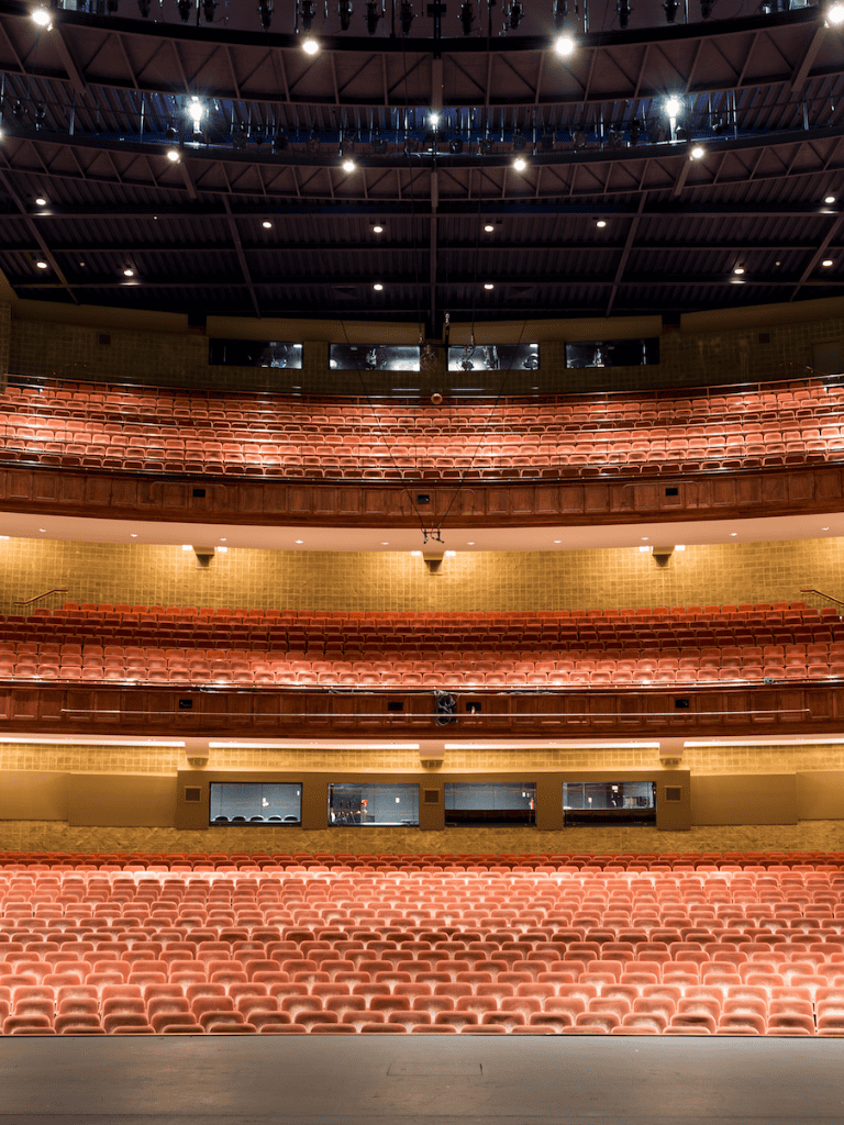 Seats in an auditorium with multiple tiers for live performances or events.