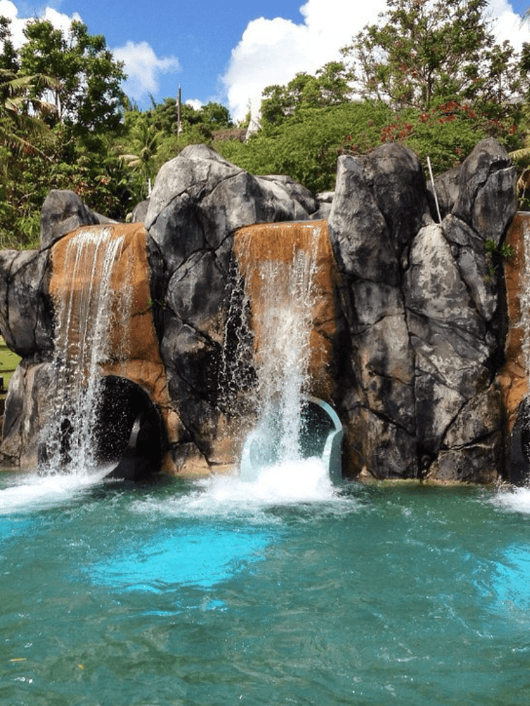 Waterfall feature at QuestForDirections outdoor adventure park.