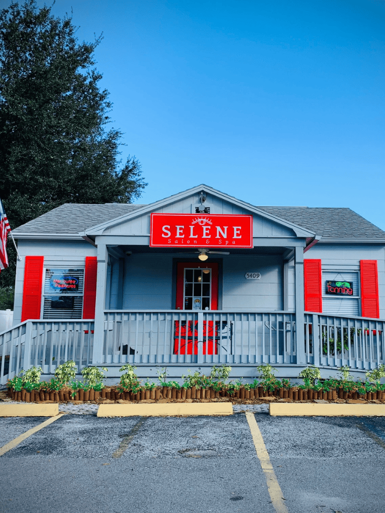 Relaxing salon and spa with a cheerful blue exterior and bright red signage for Selene Salon & Spa.