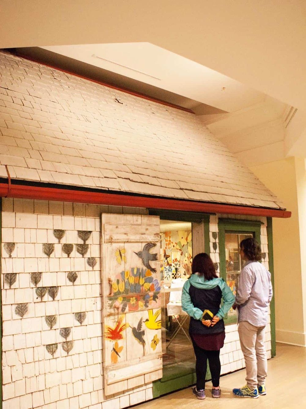 Colorful boutique shop entrance showcasing unique art pieces and inviting atmosphere.