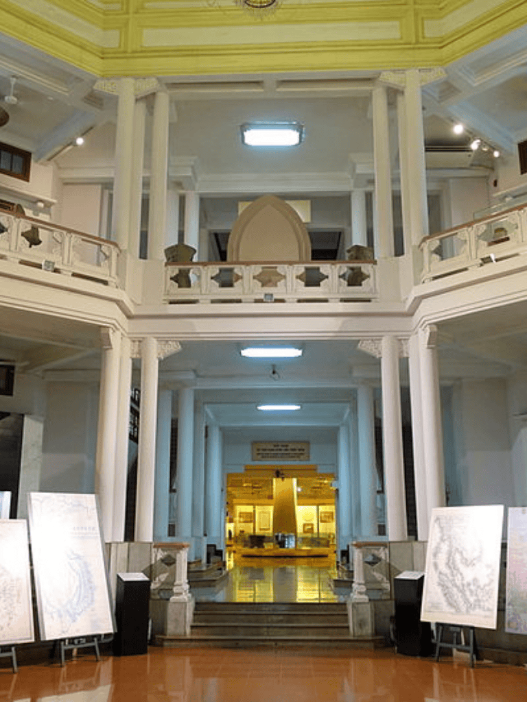 Courthouse interior with grand staircase and classical architecture.