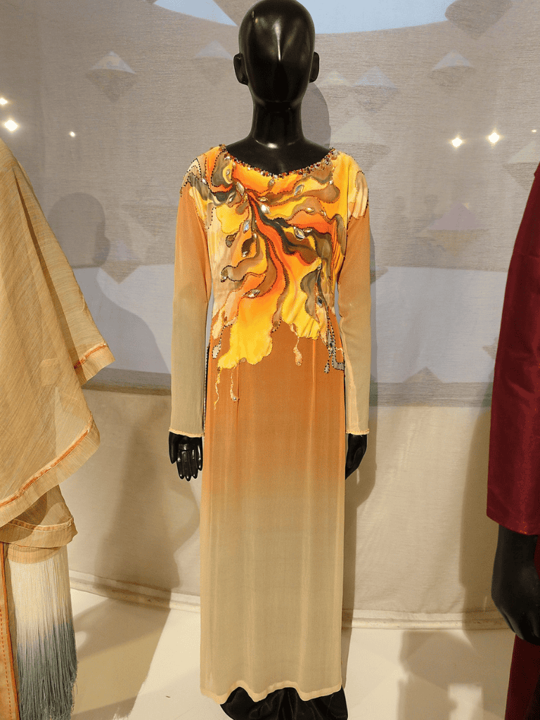 Elegant abstract printed long dress manufactured with premium fabrics, perfect for formal occasions.