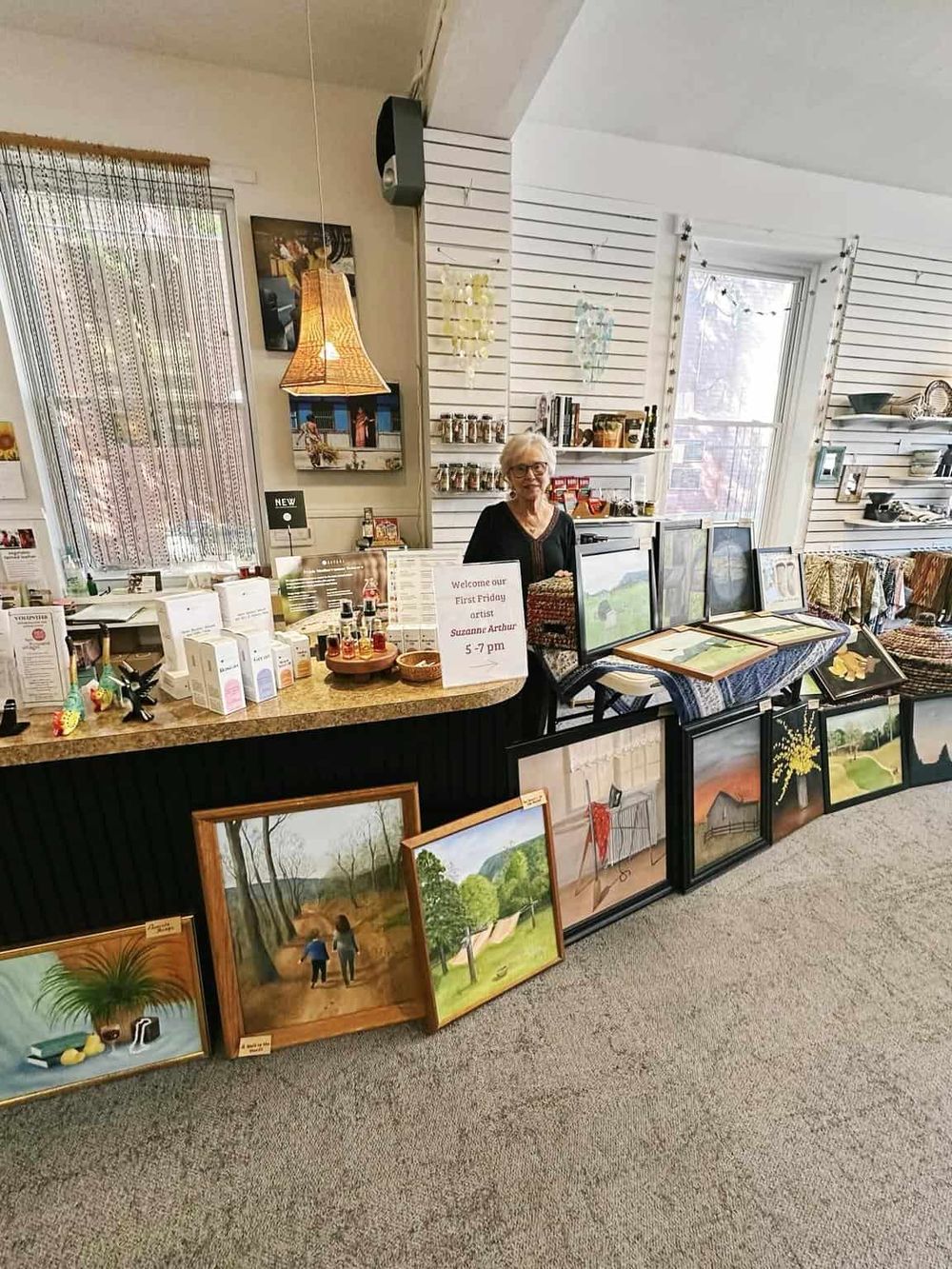 Colorful art gallery display featuring paintings and local artwork at QuestForDirections.