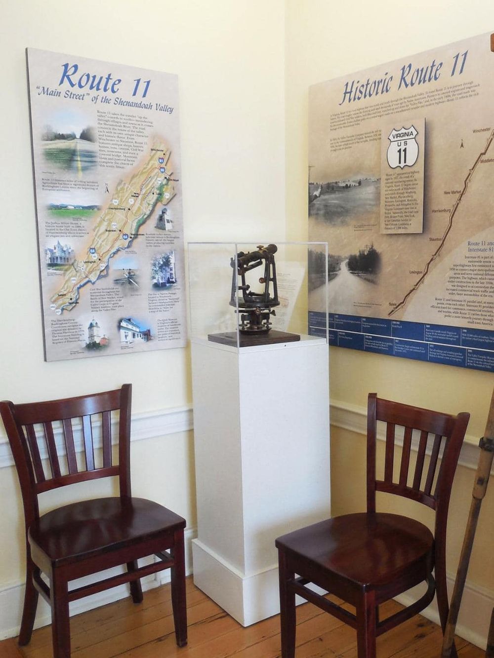 Historical Route 11 display at Quest for Directions museum, showcasing maps and vintage navigation tools.