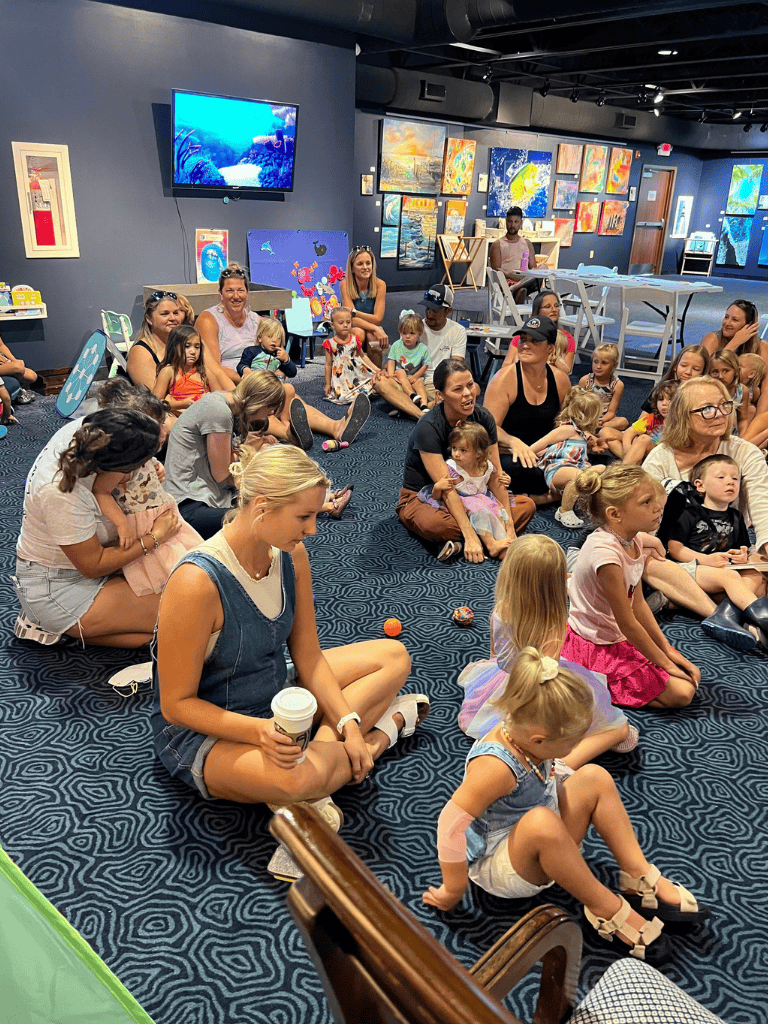 Child-friendly art event at QuestForDirections with kids and adults enjoying creative activities and colorful artwork.