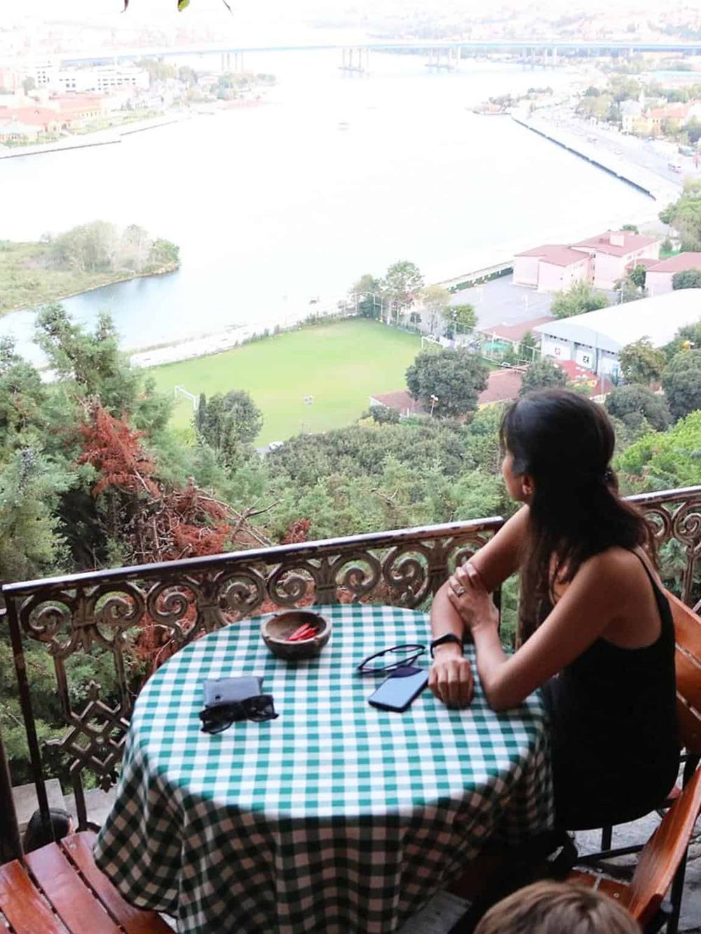 Breathtaking view of a river and cityscape from a balcony, perfect for planning adventures with QuestForDirections.