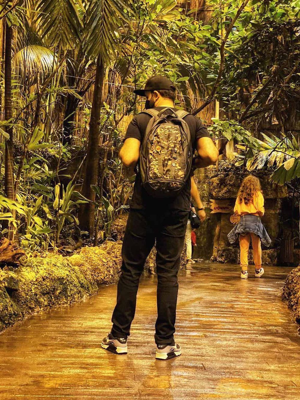 Exploring a tropical jungle with a backpack and hiking gear for adventure travel.