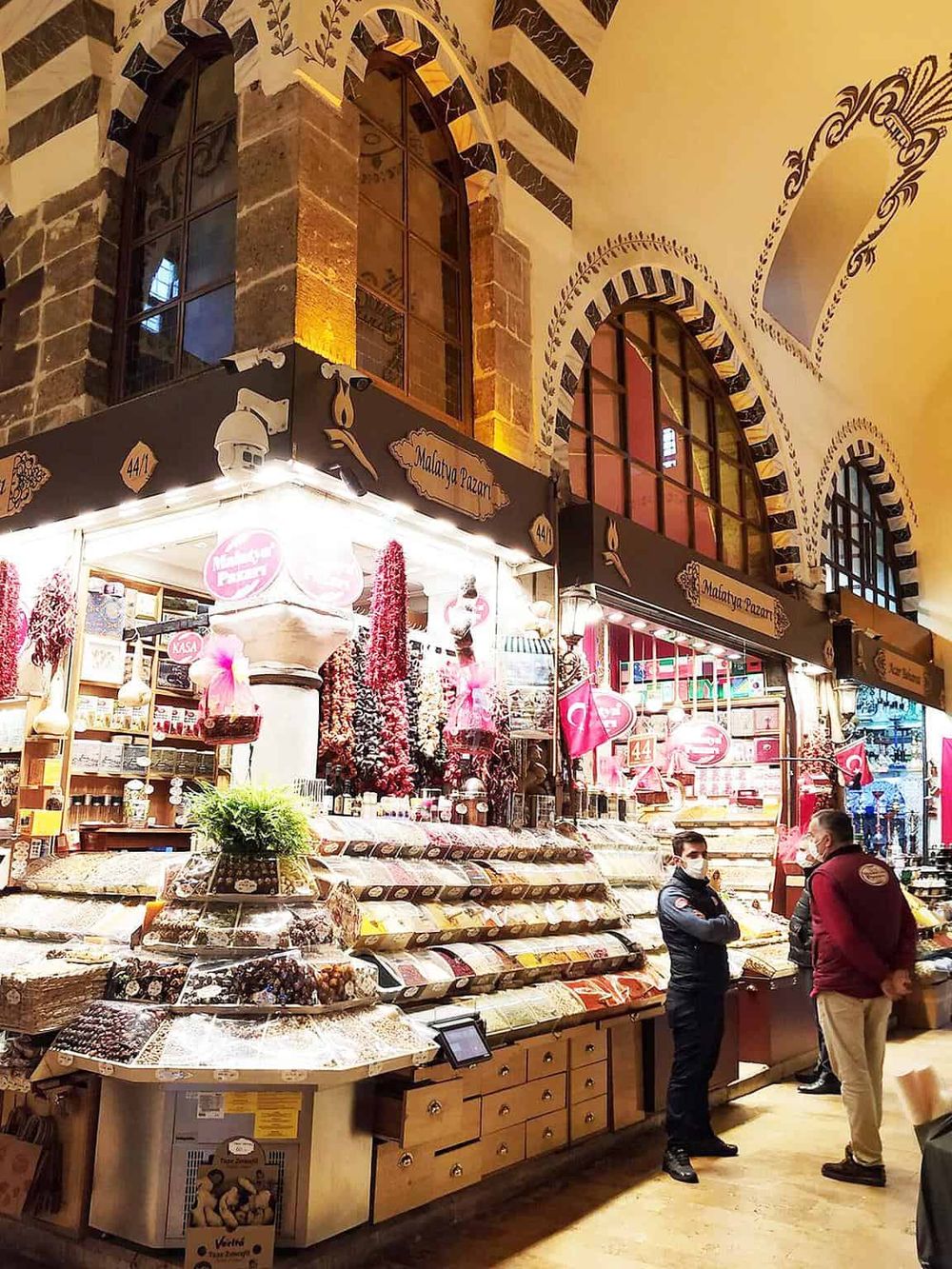 Colorful traditional Turkish chocolate shop at Madoya Pazari, vibrant interior, and customer service.
