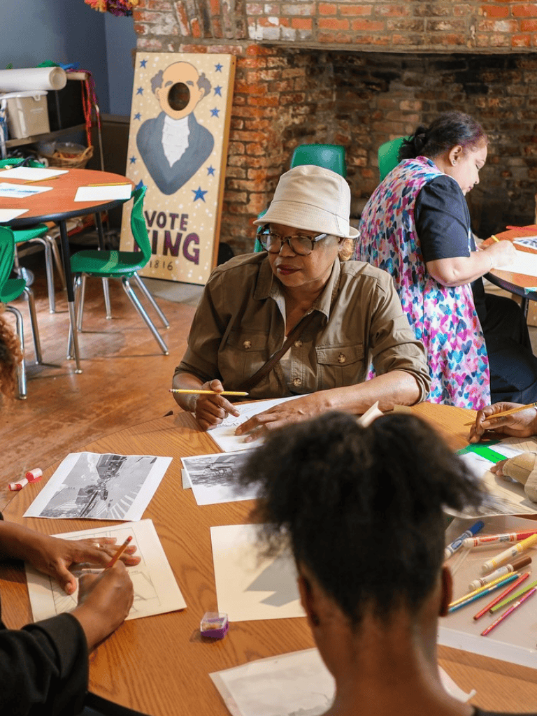 Woman participating in a community art workshop.