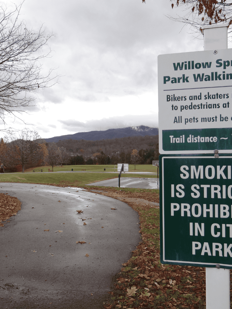 Biking and walking trail at Willow Spring Park in a scenic mountain setting.