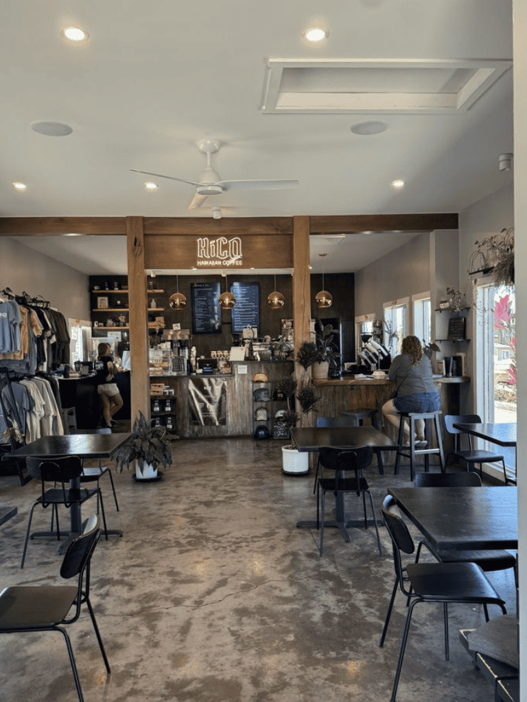 Cozy coffee shop interior with modern decor and seating area, delicious coffee, and friendly service.