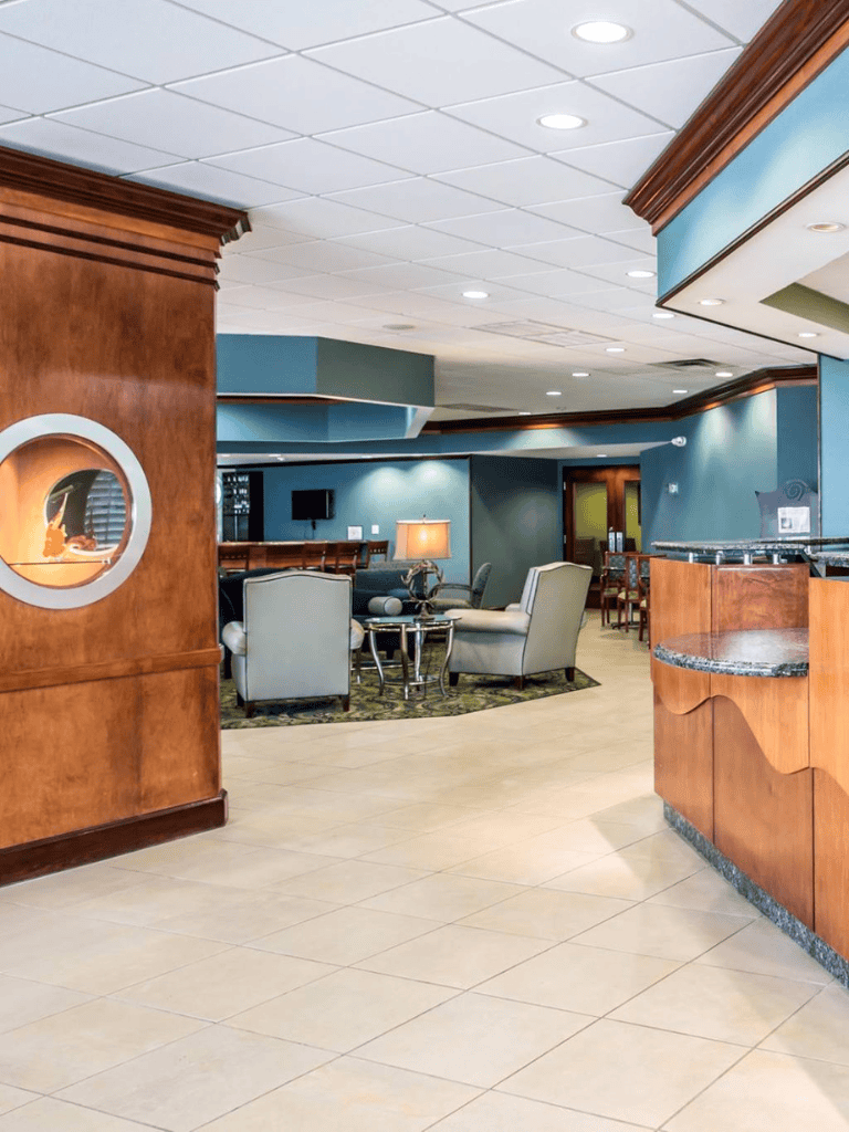 Lobby area with seating and reception desk at Quest For Directions.