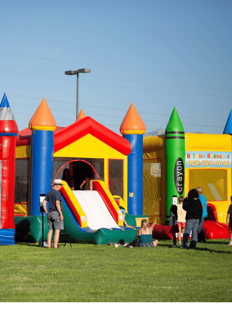 Inflatable bounce house at a family-friendly event, perfect for kids' entertainment and outdoor fun.