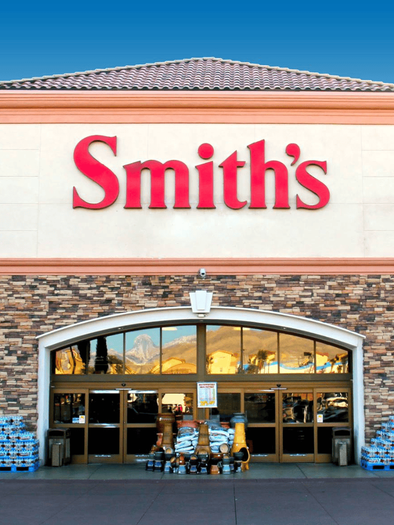 1. Large Smith's grocery store outlet with shopping carts and water bottles outside.