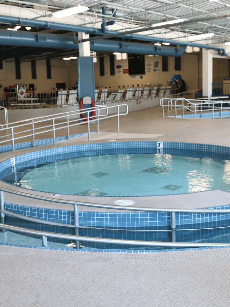 Indoor therapeutic hot tub at Quest For Directions wellness center, offering relaxation and soothing water therapy.