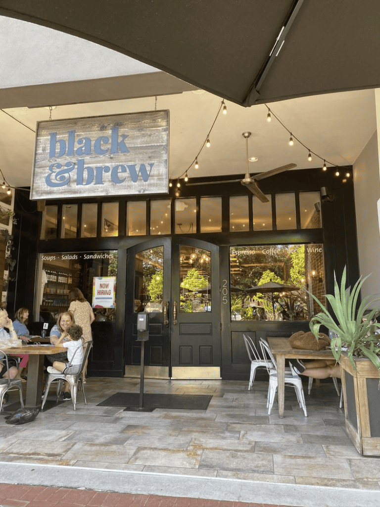 Black & brew coffee shop on a sunny day.