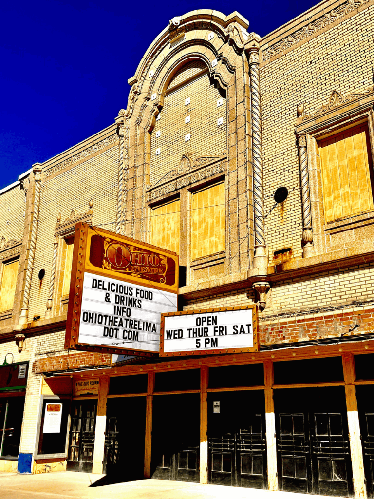 Historic Ohio Theatre marquee with showtimes and food offers in downtown Ohio.