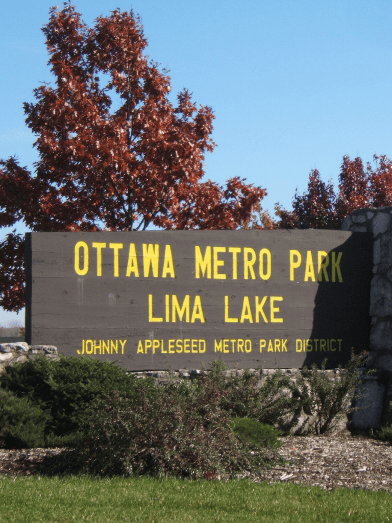 Ottawa Metro Park sign at Lima Lake, Johnny Appleseed district, outdoor park scenery.