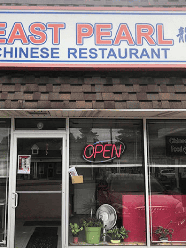 Authentic Chinese restaurant East Pearl with open sign and welcoming storefront.