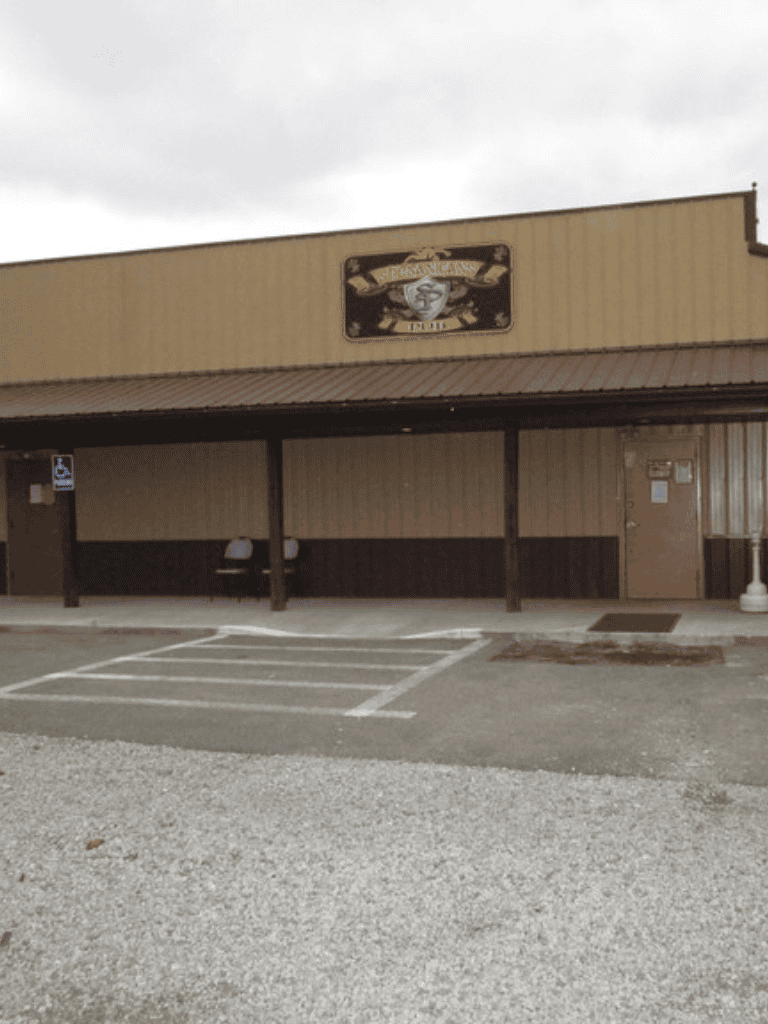 Aisle of Fame, vintage bar and restaurant in a rustic building, inviting nightlife in a small town.