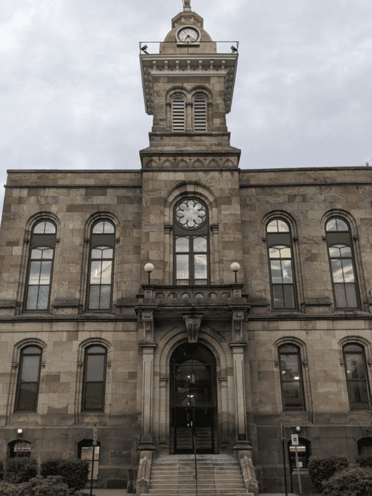 Clock tower historic government building in downtown city.