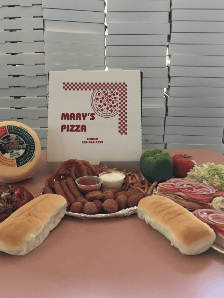 Fresh Italian pizza and sub sandwiches with cheese and toppings, served at Mary’s Pizza in Lisbon.