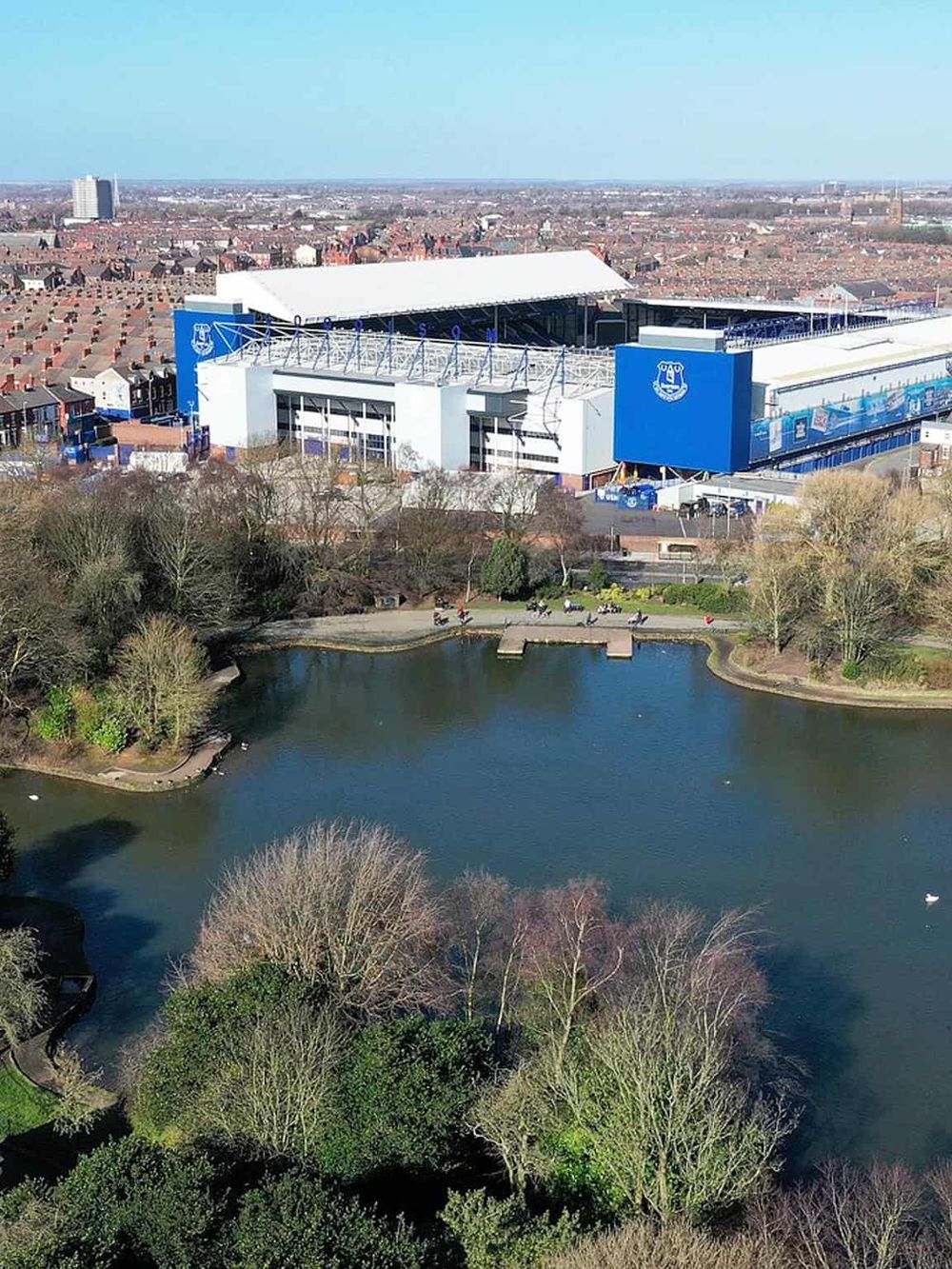 Modern Everton Stadium aerial view with park and water body, home of Everton FC, Liverpool, England.