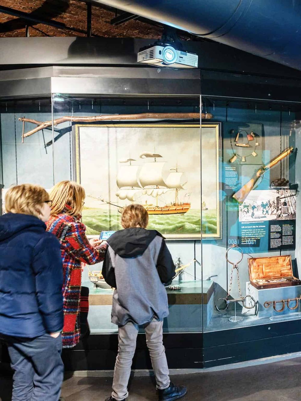 1. Vintage ship exhibit at maritime museum with ship models and historical artifacts.