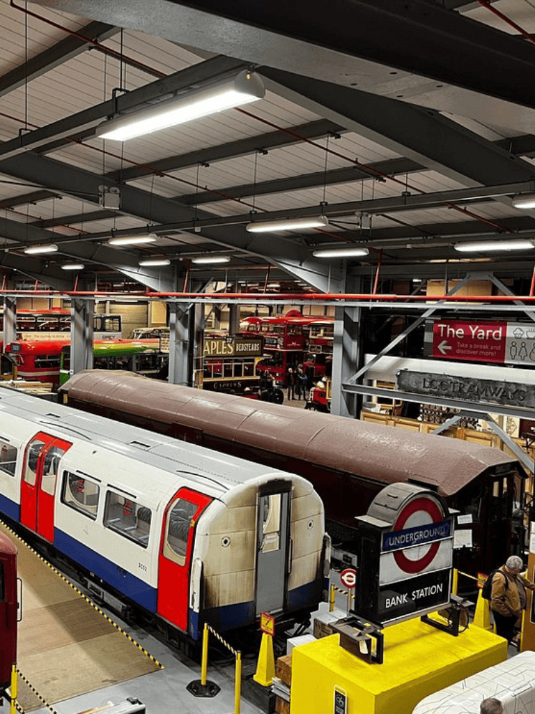 Vintage London Underground train display in a museum setting, showcasing classic transportation history.