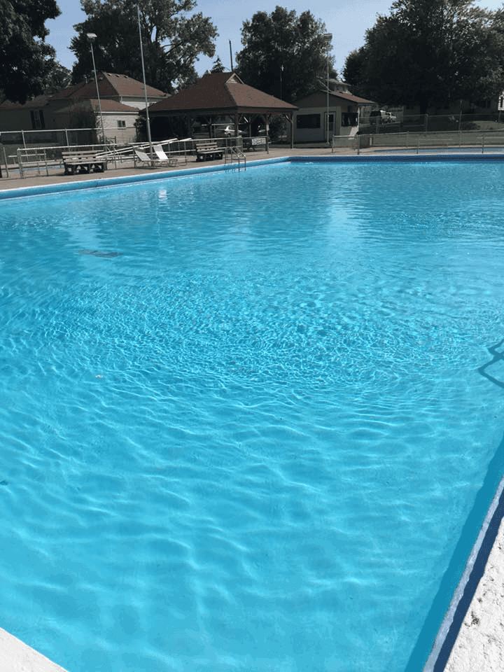 Clean outdoor swimming pool with clear blue water at Quest For Directions.