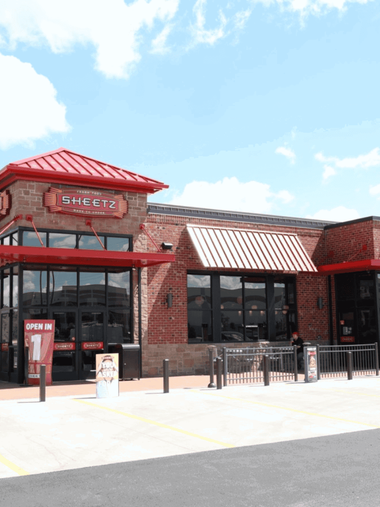 1. Sheetz convenience store and gas station with red brick exterior and modern design.