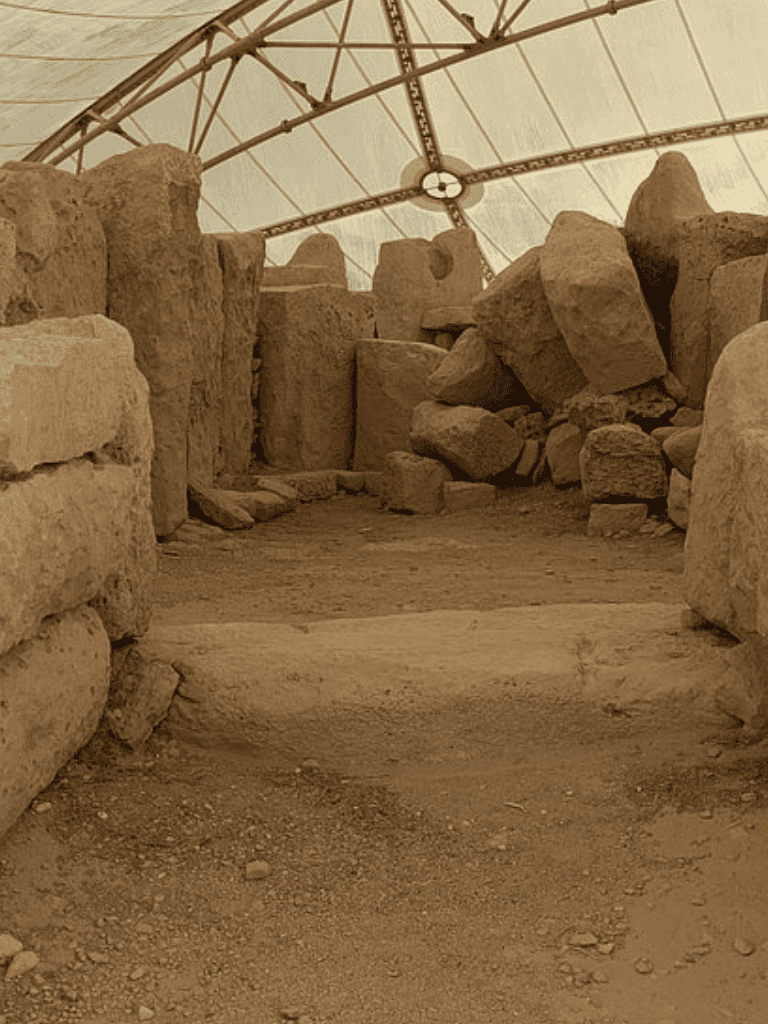 Ancient stone ruins under protective covering for archaeological preservation.