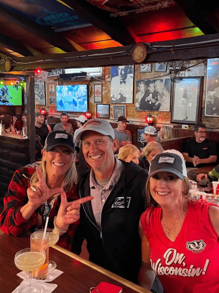 - Cozy bar scene with happy friends enjoying drinks at QuestForDirections restaurant.