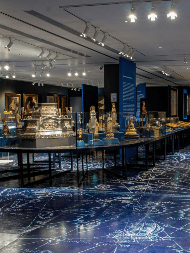 Ancient artifacts display at QuestForDirections museum exhibit, showcasing historical treasures and cultural heritage.