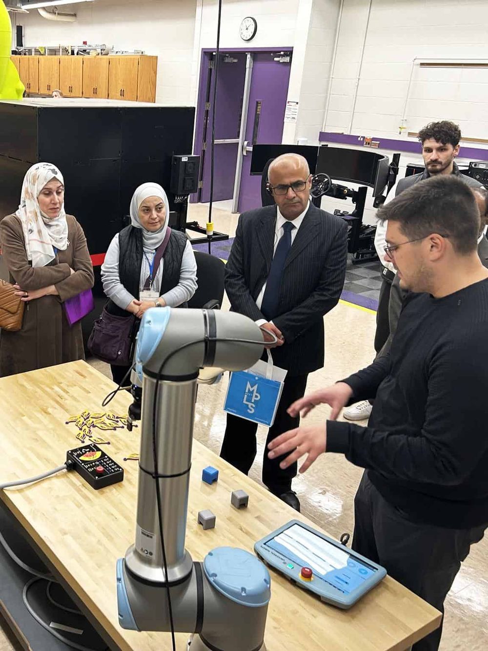 AI-powered robotic arm demonstrating technology at Quest for Directions event.