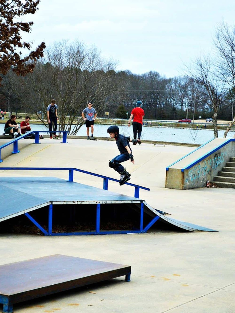 Skateboarder performing tricks at outdoor skate park in QuestForDirections.
