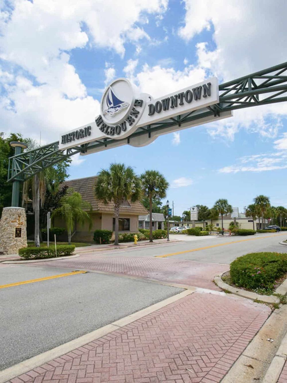 Charming downtown historic waterfront with palm trees, shops, and vibrant atmosphere in Florida.